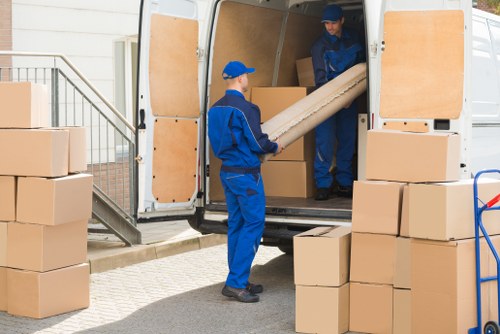 Van and moving boxes in a busy Deptford street