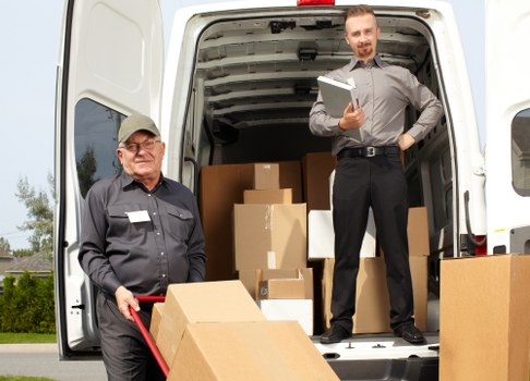 Removal team loading household items for a Deptford move