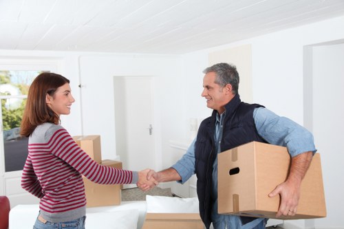 Trained moving staff handling boxes with care