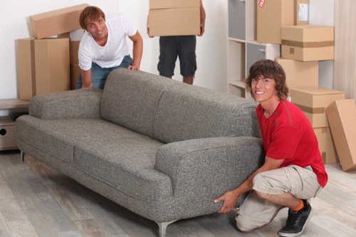 Careful handling of furniture during a flat move in Deptford